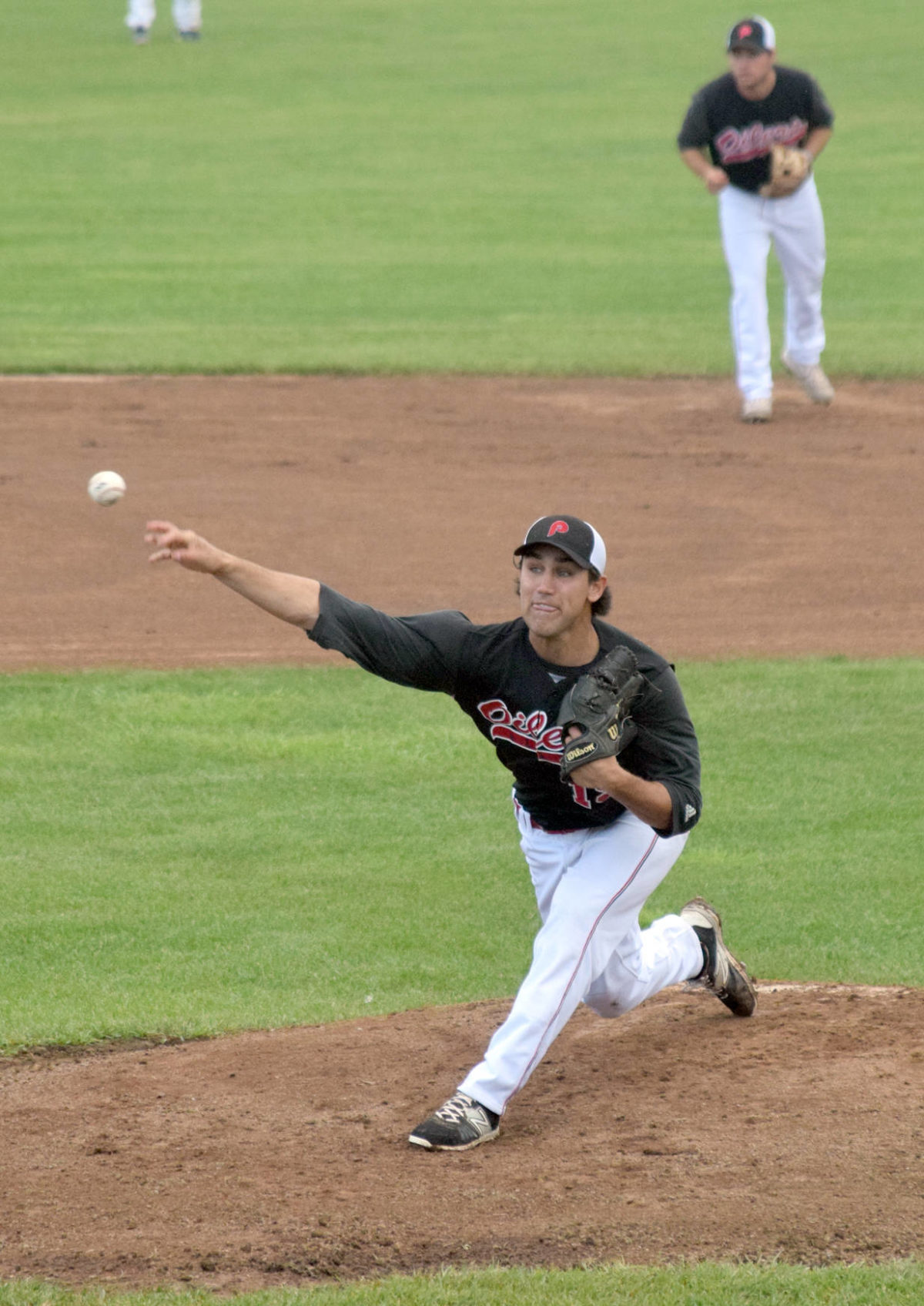 Oilers starting pitcher Mike Lopez delivers to the Chugiak-Eagle River Chinooks on Thursday, June 21, 2018, at Coral Seymour Memorial Park in Kenai. (Photo by Jeff Helminiak/Peninsula Clarion)