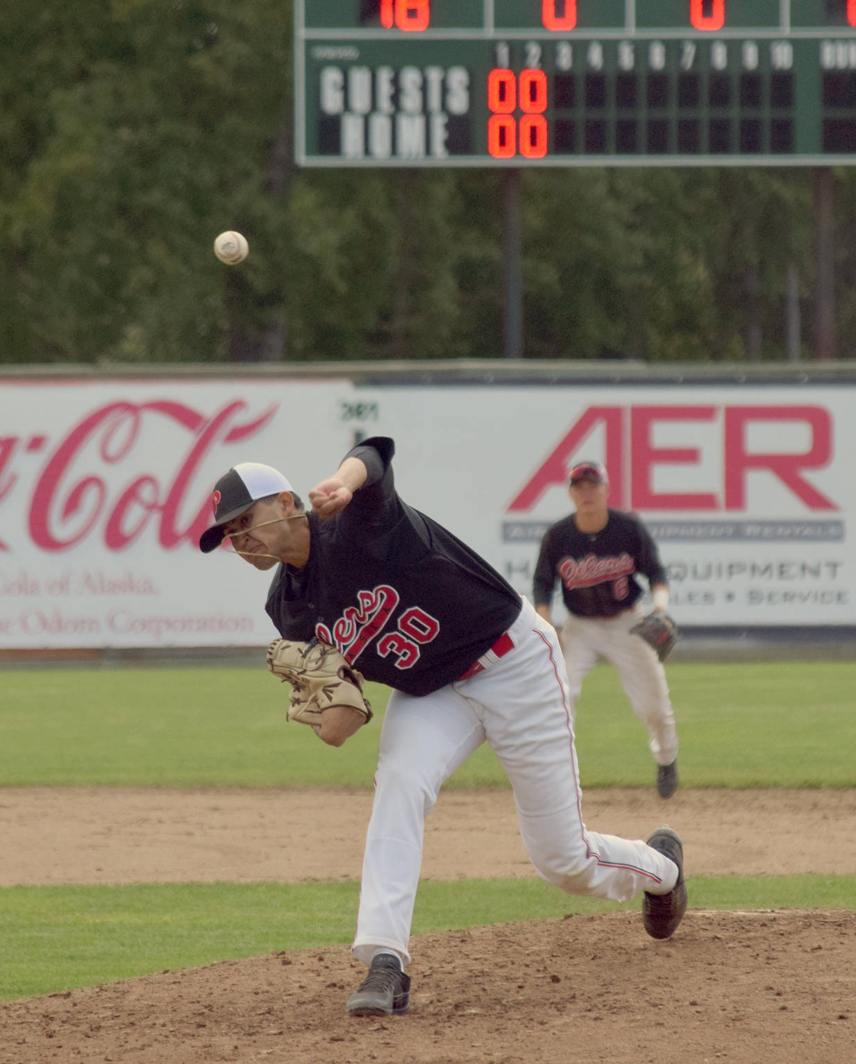 Oilers starting pitcher Christian Winston delivers to the Chugiak-Eagle River Chinooks on Sunday, June 24, 2018, at Coral Seymour Memorial Park in Kenai. (Photo by Jeff Helminiak/Peninsula Clarion)