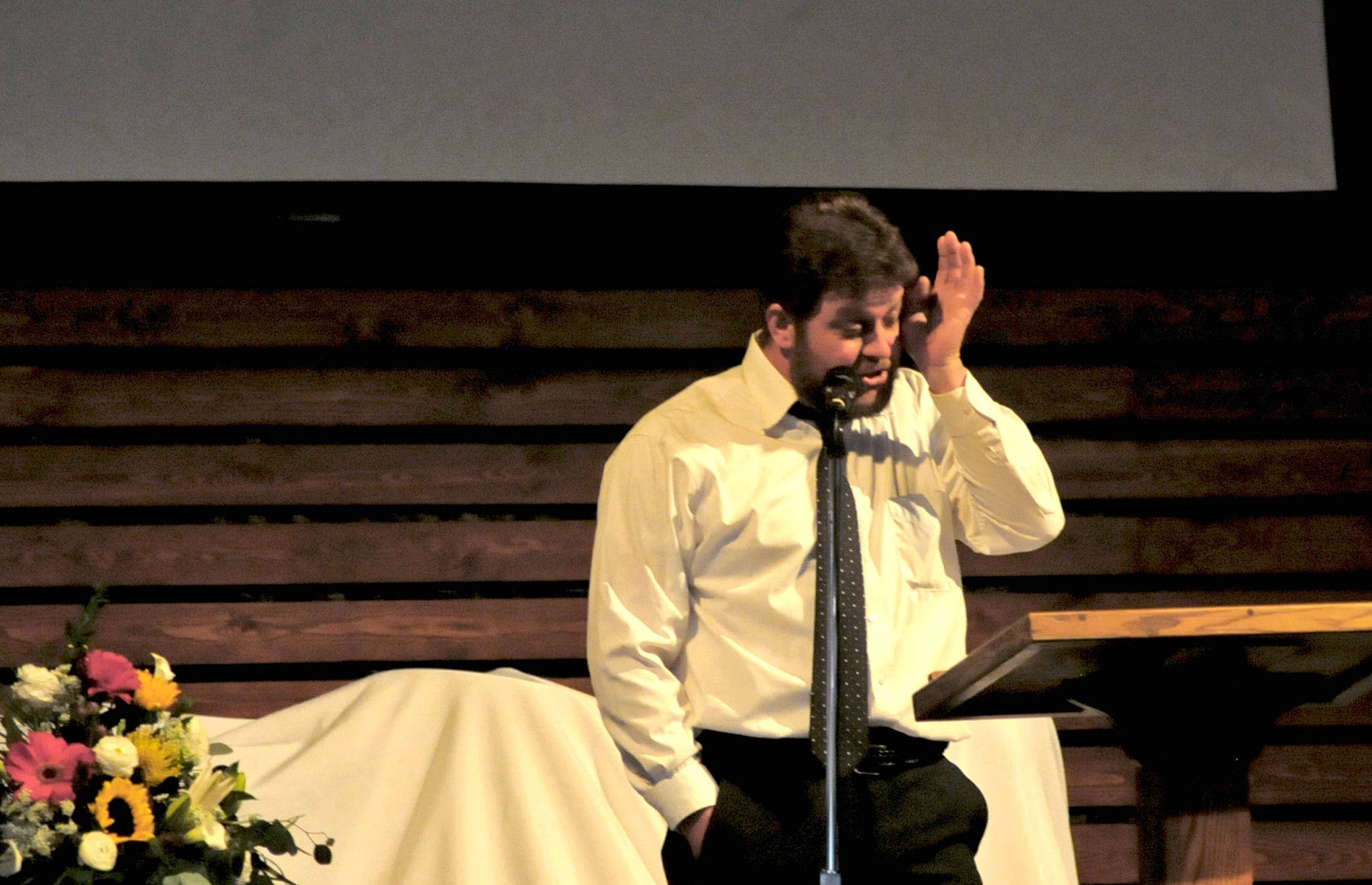 Criss Adams wipes his eyes while giving a eulogy for Travis Stubblefield at Peninsula Grace Brethren Church on Saturday, June 30, 2018 near Soldotna, Alaska. Stubblefield, a lifelong resident of the Soldotna area, was killed June 21 in a conflict in Kasilof. Alaska State Troopers are investigating the circumstances of his death, though no charges have yet been filed. (Photo by Elizabeth Earl/Peninsula Clarion)