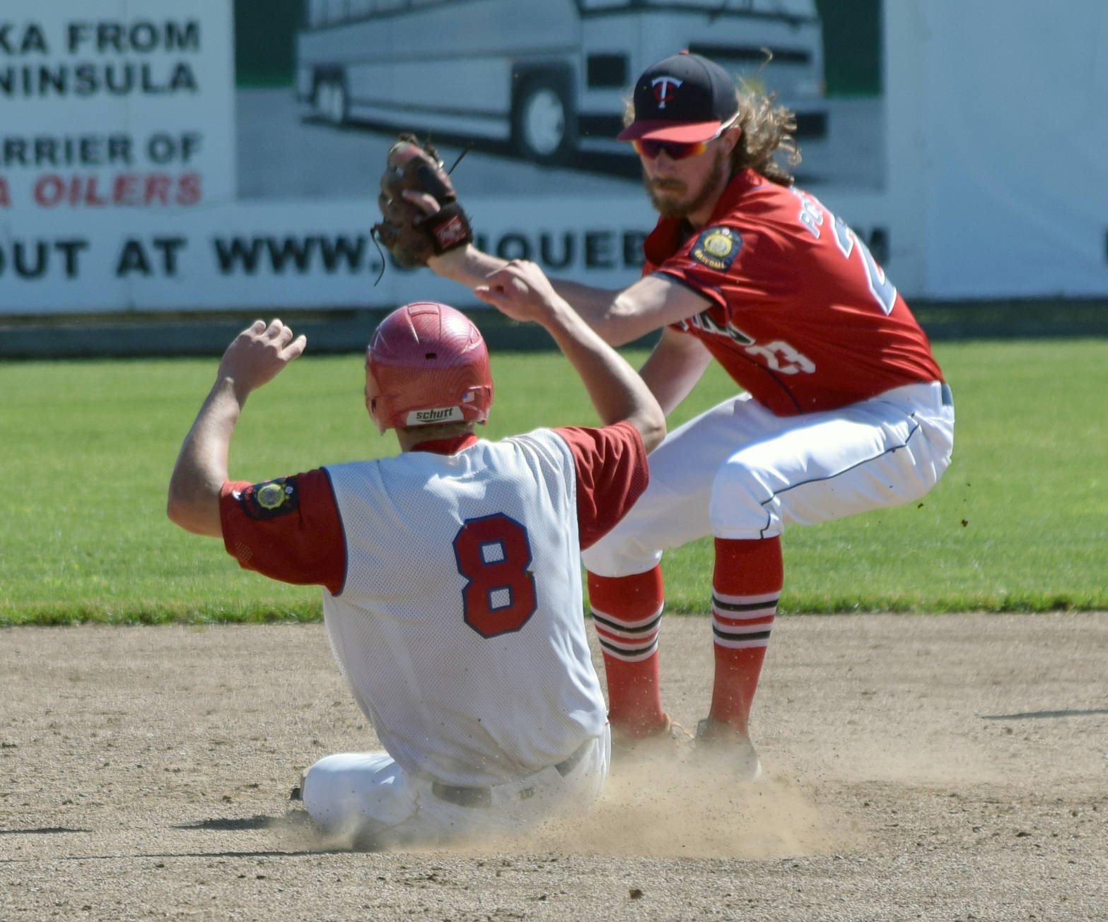 Twins second baseman David Michael tags out Nick Thimsen of Excelsior Post 259 of Minneapolis on a stolen base attempt Tuesday, July 3, 2018, at Coral Seymour Memorial Park in Kenai. (Photo by Jeff Helminiak/Peninsula Clarion)