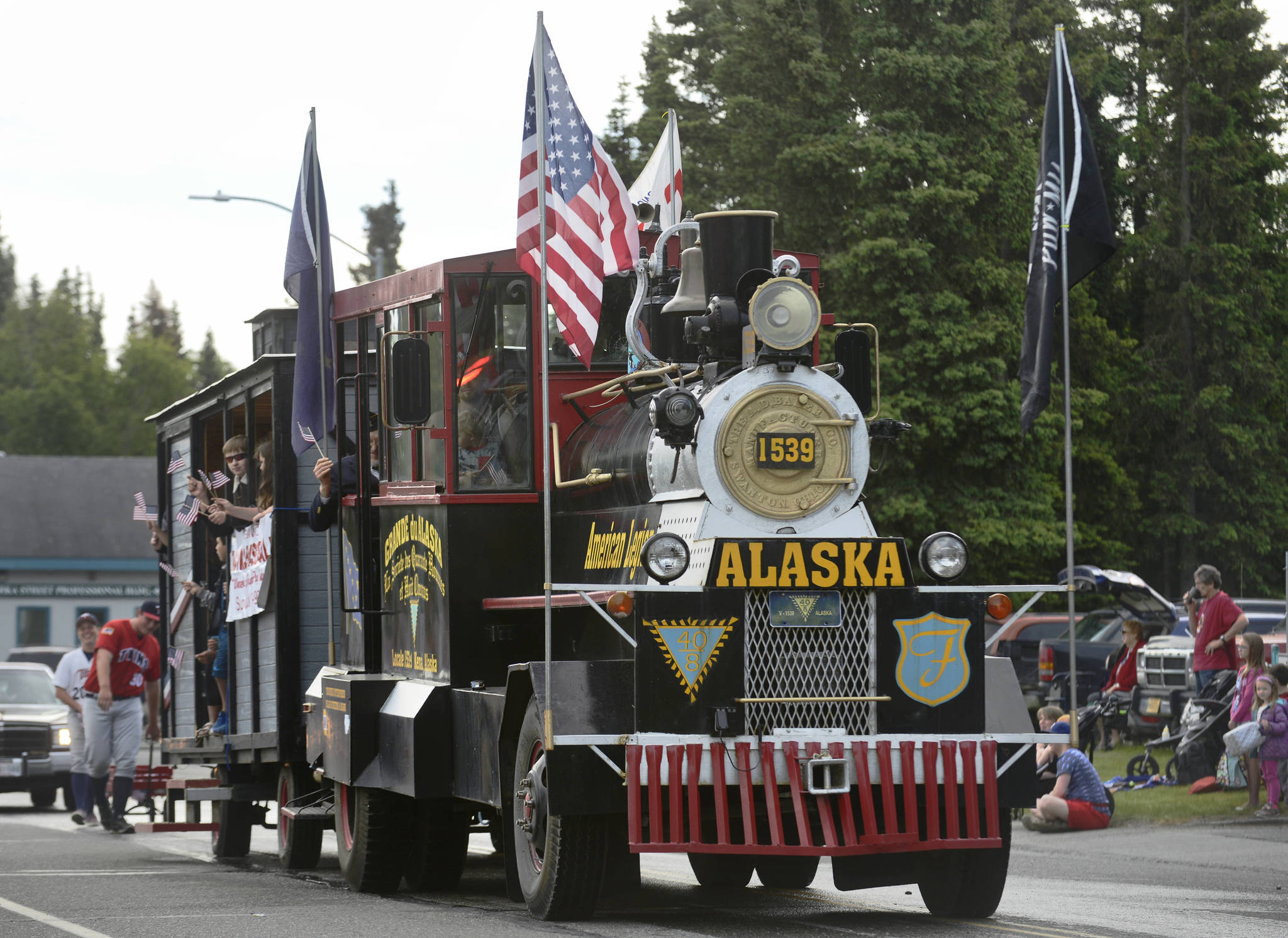Kenai’s American Legion Post 20 drives their truck remodeled as a steam locomotive during Kenai’s Fourth of July parade on Wednesday, July 4, 2018 in Kenai, Alaska. Aboard are members of the Legion-sponsored Twins baseball team. (Ben Boettger/Peninsula Clarion)                                  Snare drummers from Kenai Central High School’s drumline perform in the Kenai’s Fourth of July parade on Wednesday, July 4, 2018 in Kenai, Alaska. (Ben Boettger/Peninsula Clarion)                                 Wildland firefighters from the Alaska Division of Forestry march in Kenai’s Fourth of July parade on Wednesday, July 4 in Kenai, Alaska. (Ben Boettger/Peninsula Clarion)
