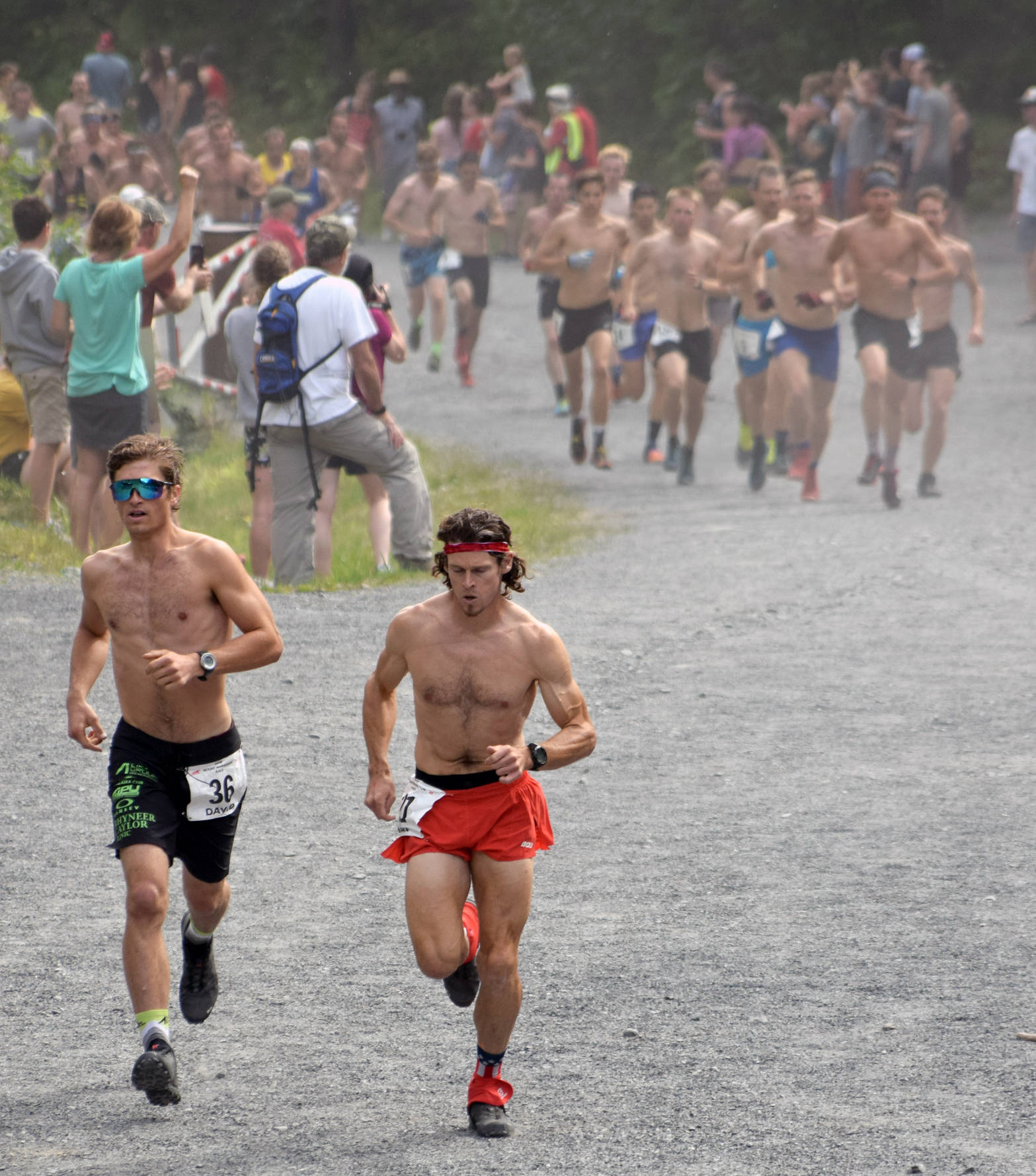 Eventual champion David Norris of Anchorage and eventual runner-up Max King of Bend, Oregon, leave the rest of the field in the dust during the road portion of the Mount Marathon Race on Wednesday, July 4, 2018, in Seward. (Photo by Jeff Helminiak/Peninsula Clarion)