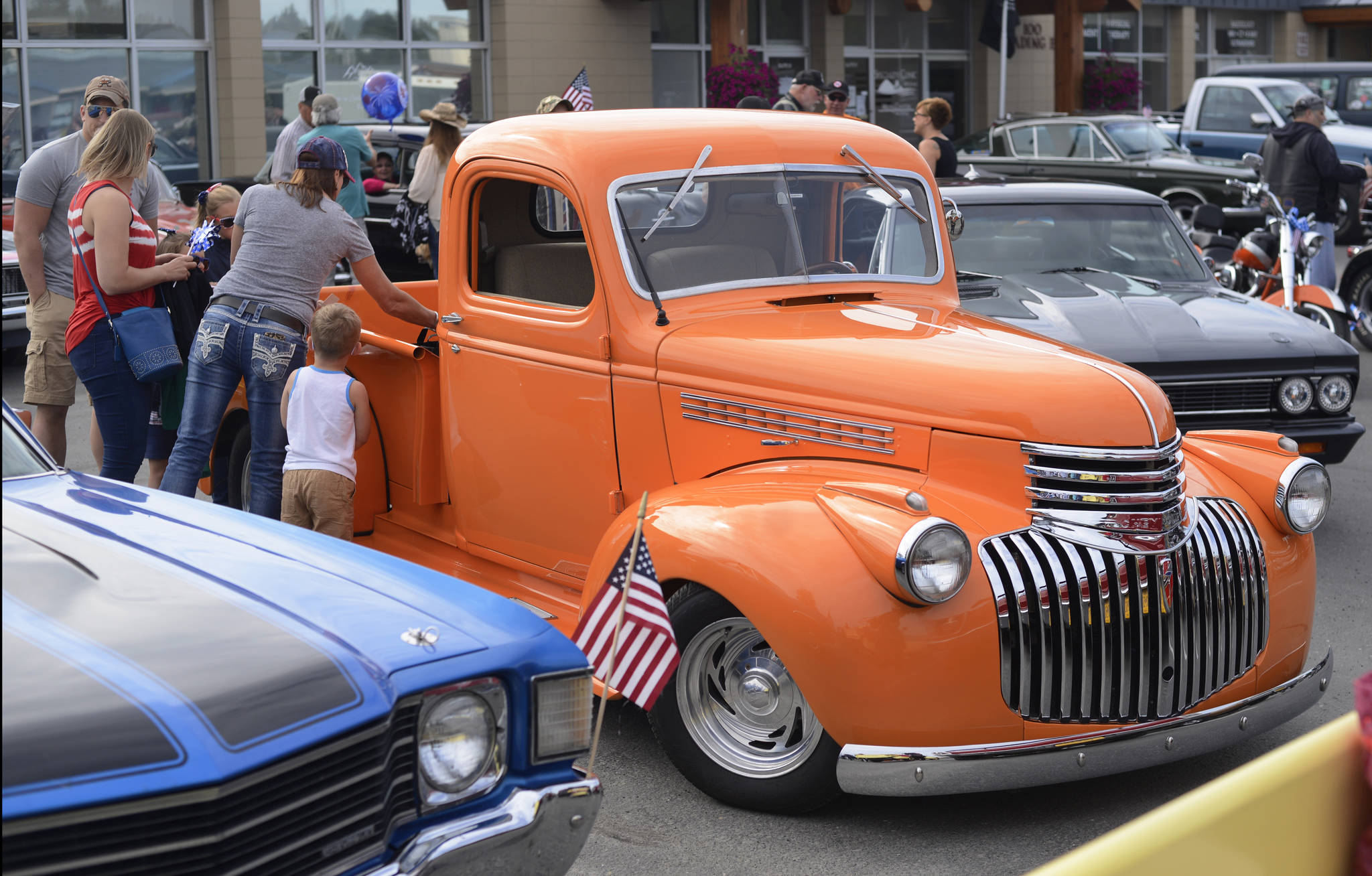 Vintage vehicles owned by members of the Kaknu Kruzers Car Club gather before Kenai’s Fourth of July parade on Wednesday, July 4, 2018 in Kenai, Alaska. (Ben Boettger/Peninsula Clarion)