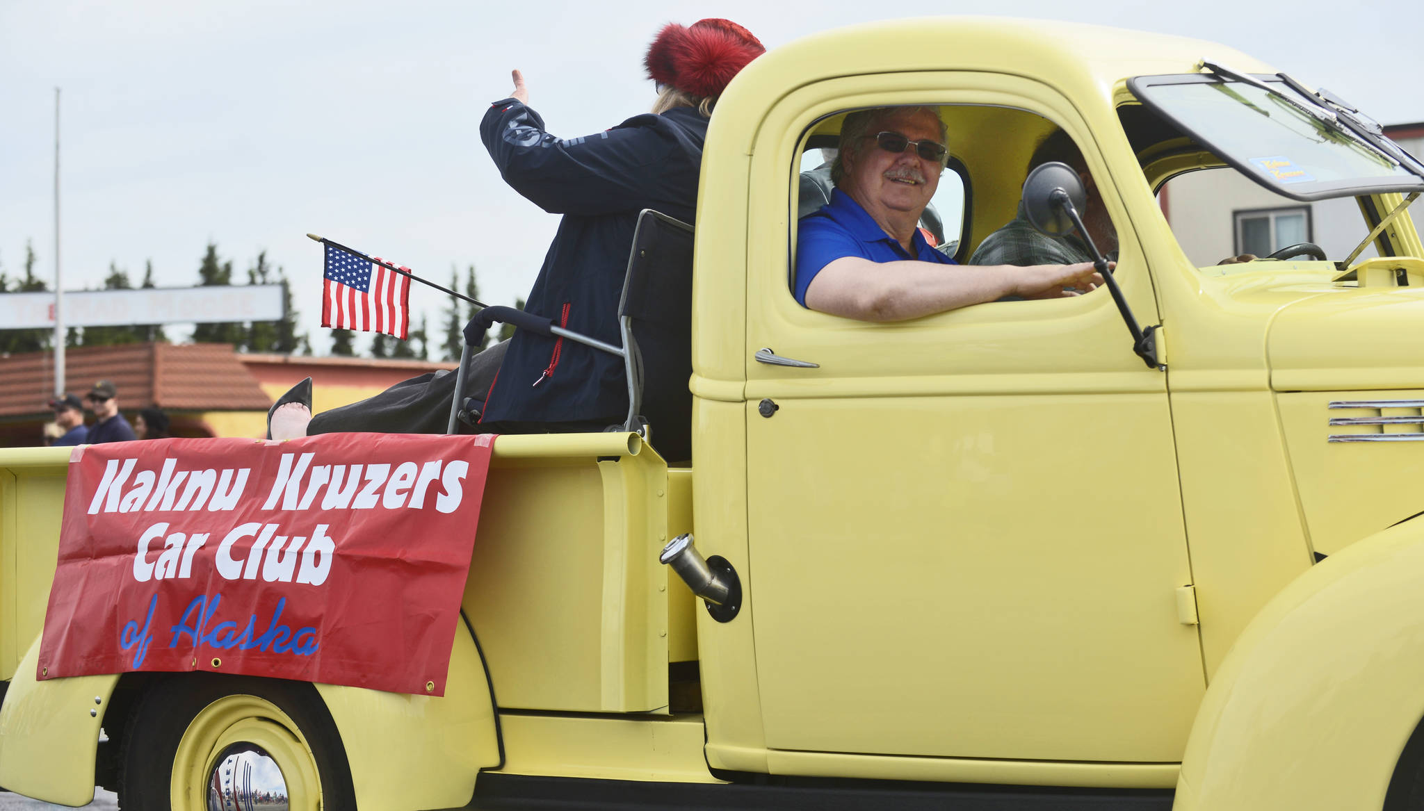Members of the Kaknu Kruzers Car Club lead a procession of vintage vehicles in the Kenai Fourth of July parade on Wednesday, July 4, 2018 in Kenai, Alaska. (Ben Boettger/Peninsula Clarion).