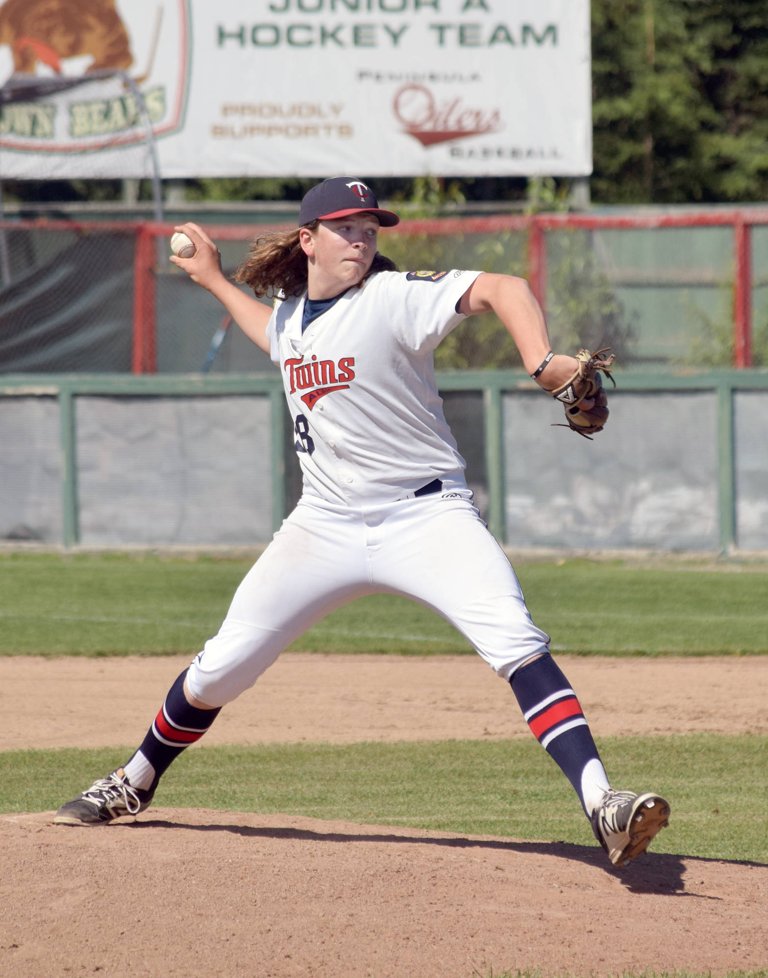 Twins starter Logan Smith delivers to East on Thursday, July 5, 2018, at Coral Seymour Memorial Park in Kenai. (Photo by Jeff Helminiak/Peninsula Clarion)