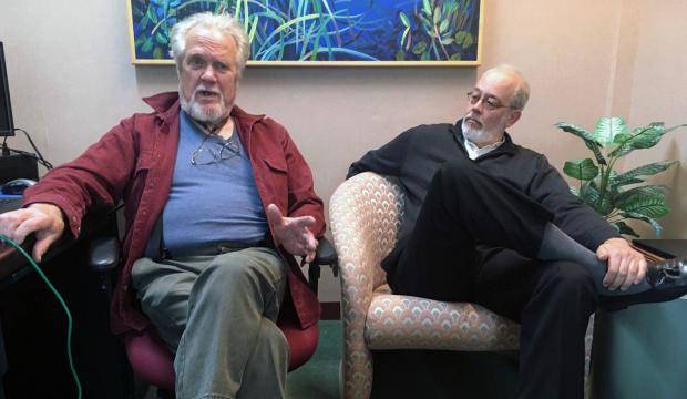 Eric Forrer, left, and Joe Geldhof, right, have sued the state of Alaska in an attempt to stop a plan that calls for borrowing up to $1 billion from global bond markets to pay oil and gas tax credits owed by the state. They are pictured May 22, 2018 in an interview at the Juneau Empire. (James Brooks | Juneau Empire File)