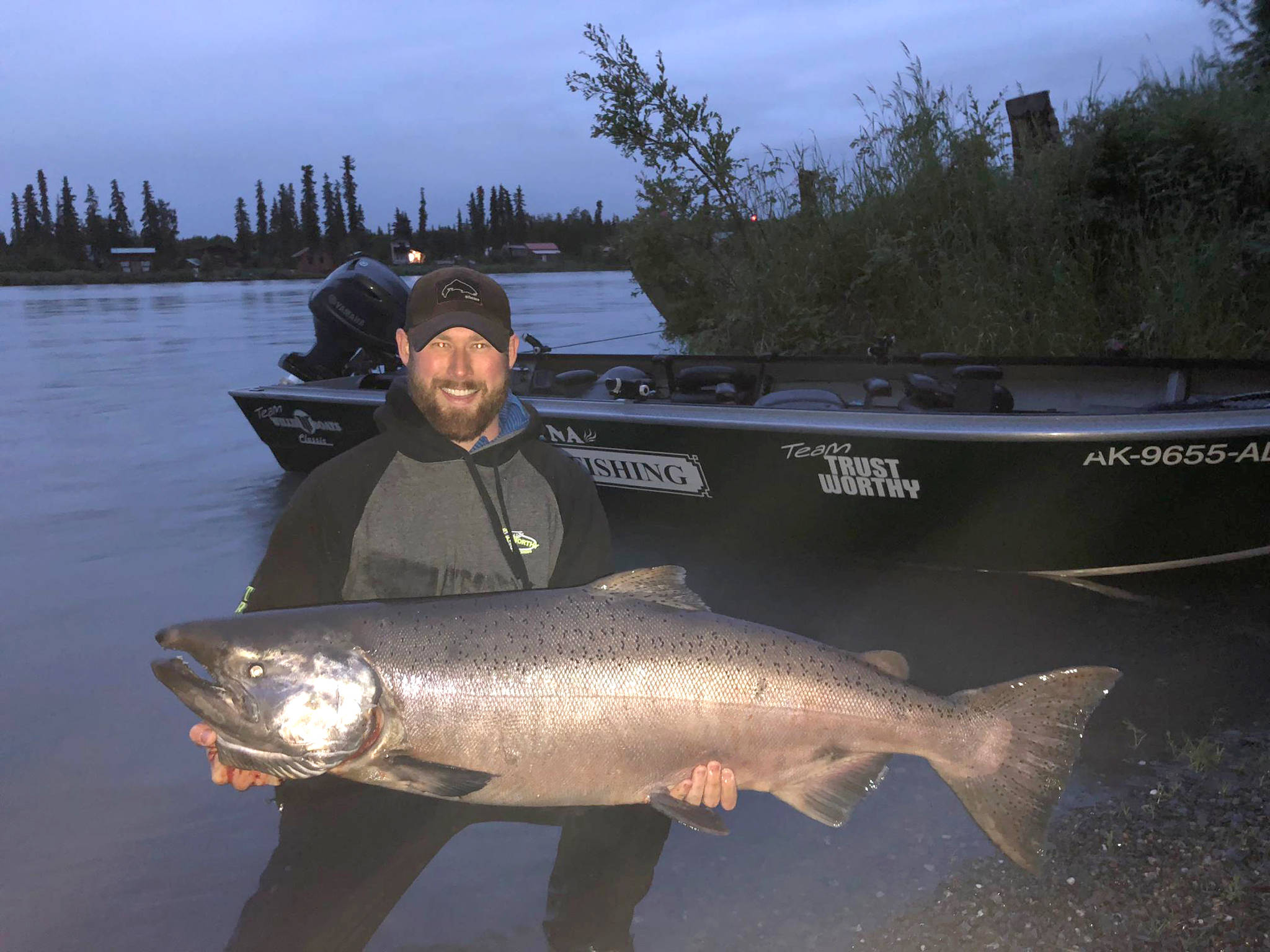 Sean Carlson shows off the 50-inch king salmon he caught on the Kenai River. (Photo courtesy Scott Miller)