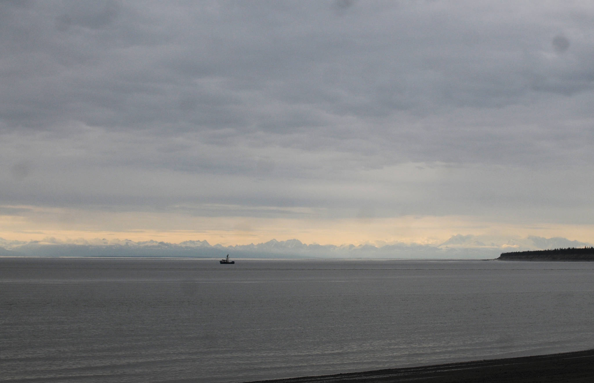 In this July 2016 photo, a drift gillnet fishing vessel floats in Cook Inlet just off the coast of the Kenai Peninsula near Kenai, Alaska. A thin season for sockeye and kings has led to restrictions in all fisheries, though drifters are seeing more chum salmon than usual in Upper Cook Inlet. (Photo by Elizabeth Earl/Peninsula Clarion, file)
