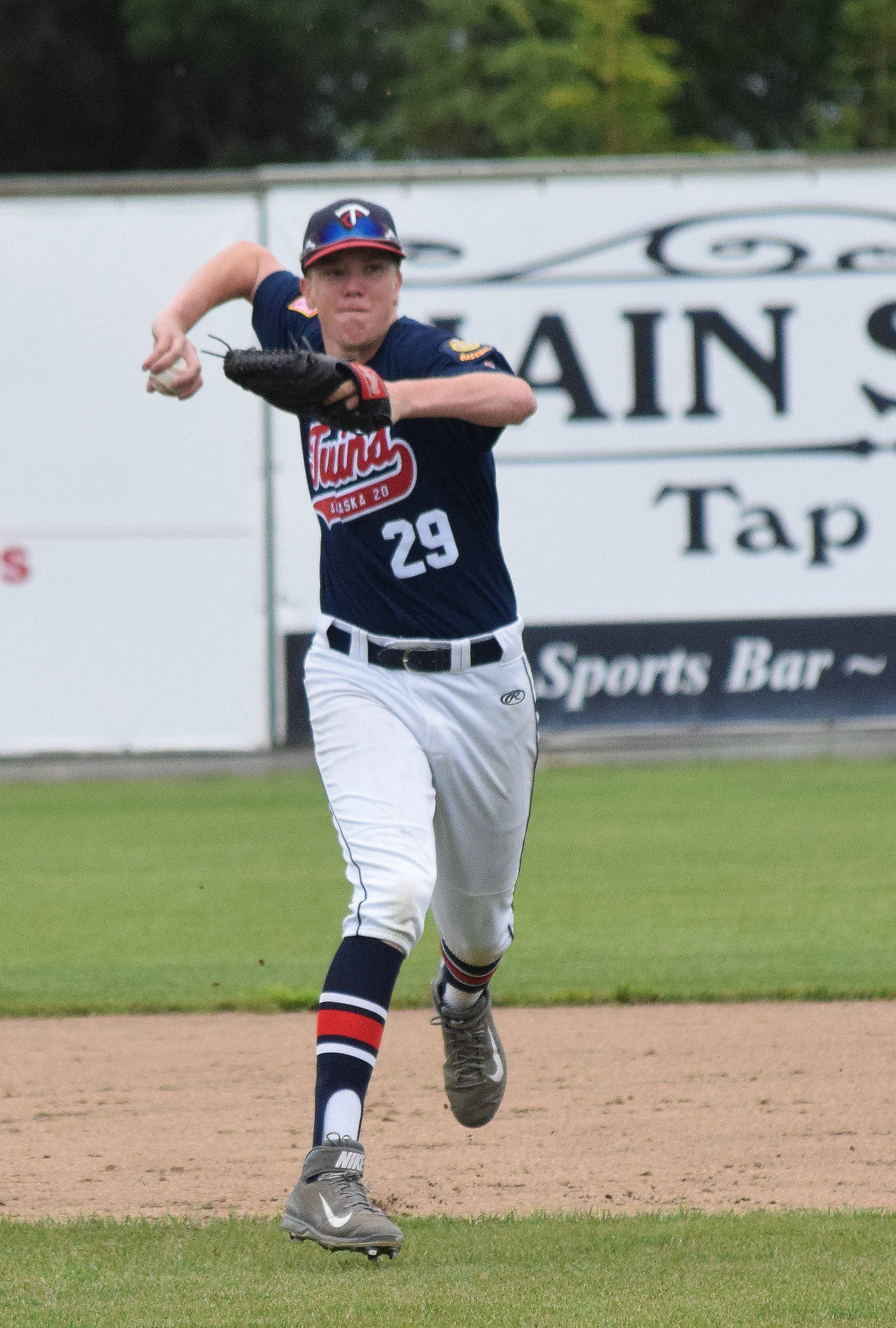 Legion Twins shortstop Austin Asp fields a grounder from a Dimond batter Friday afternoon at Coral Seymour Memorial Ballpark. (Photo by Joey Klecka/Peninsula Clarion)