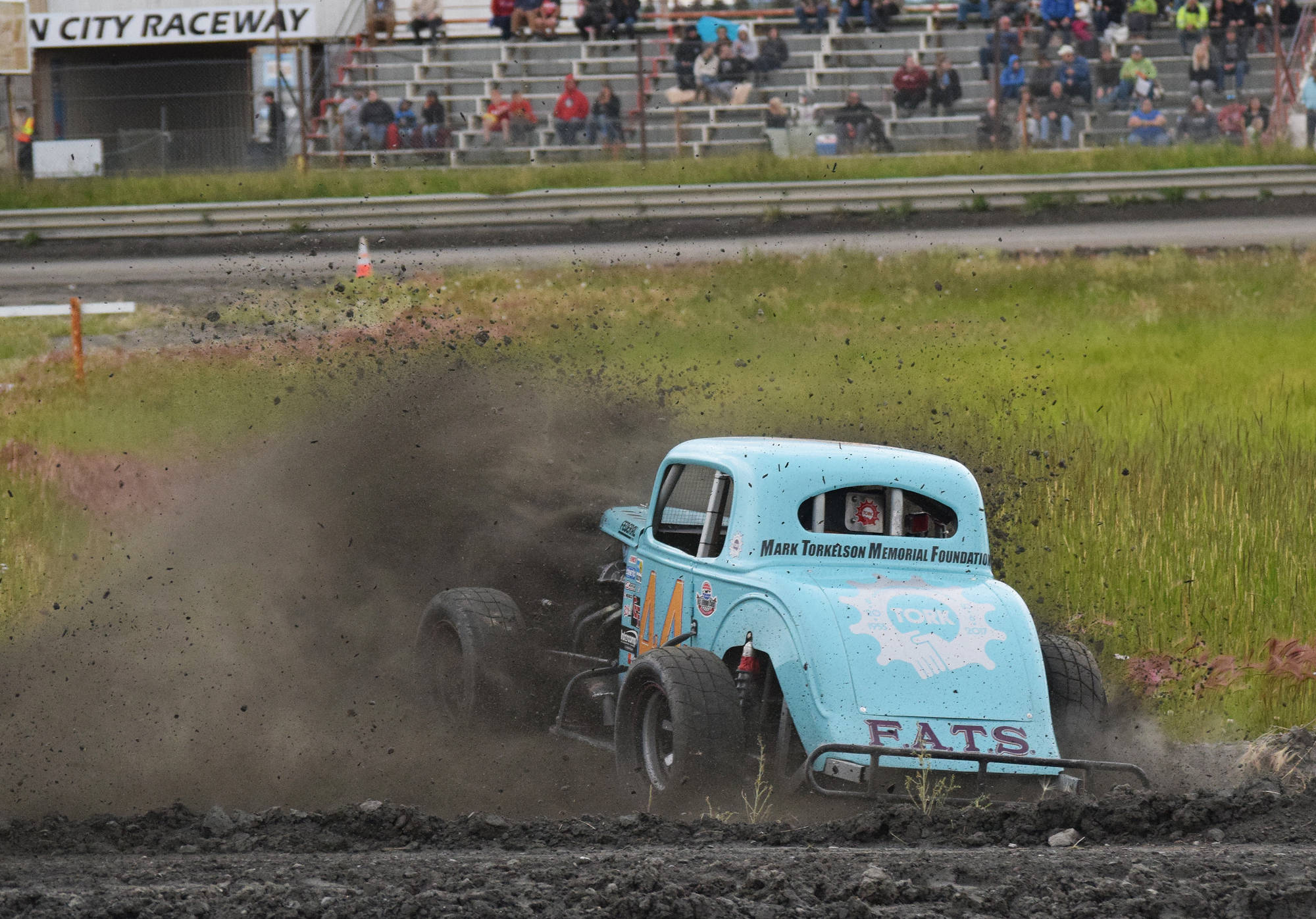 Ty Torkelson spins through the dirt Saturday night in a Legends heat race at Twin City Raceway in Kenai. (Photo by Joey Klecka/Peninsula Clarion)