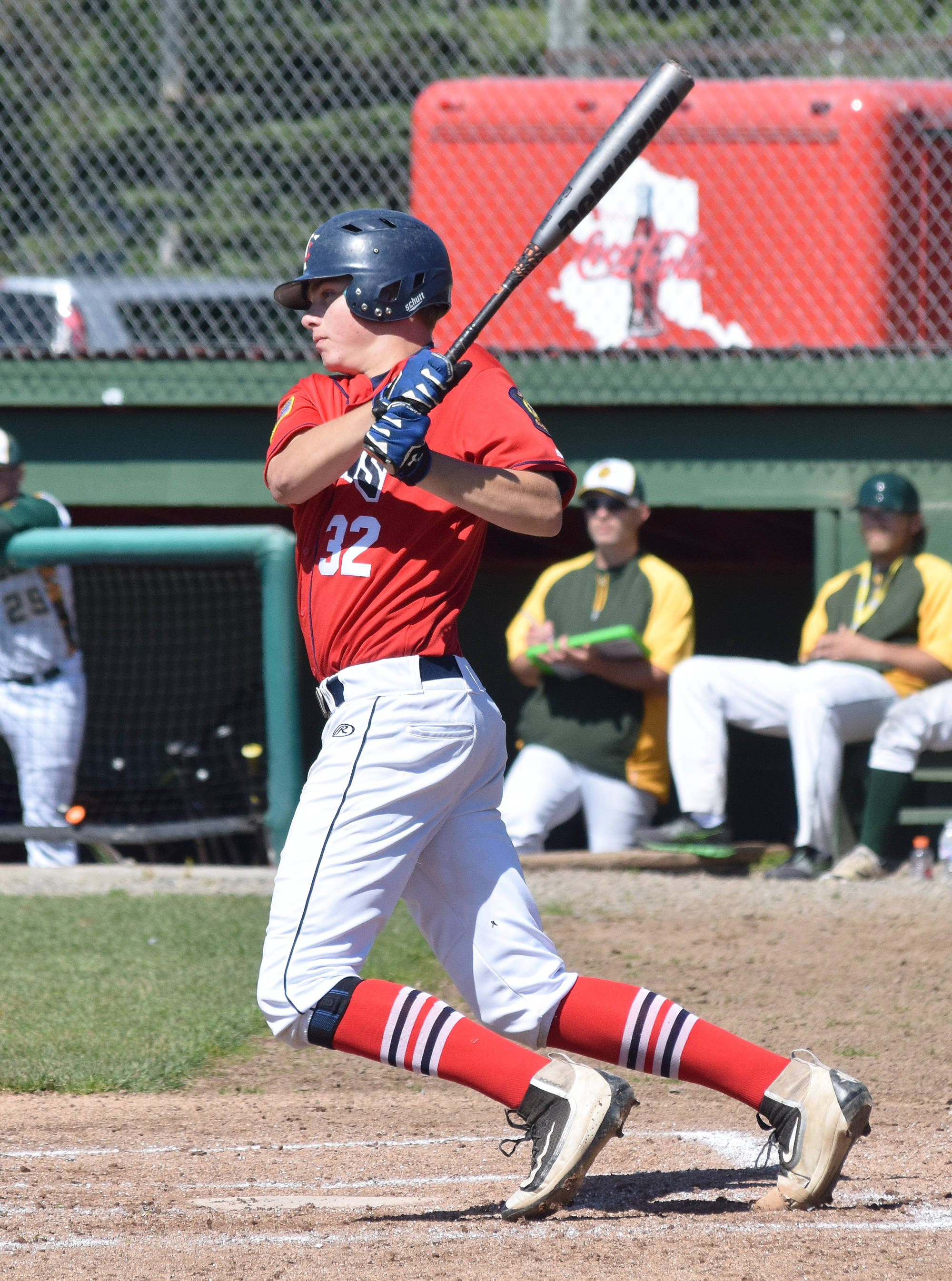Twins batter Adam Brinster hits a single Tuesday afternoon against Service at Coral Seymour Memorial Ballpark in Kenai. (Photo by Joey Klecka/Peninsula Clarion)