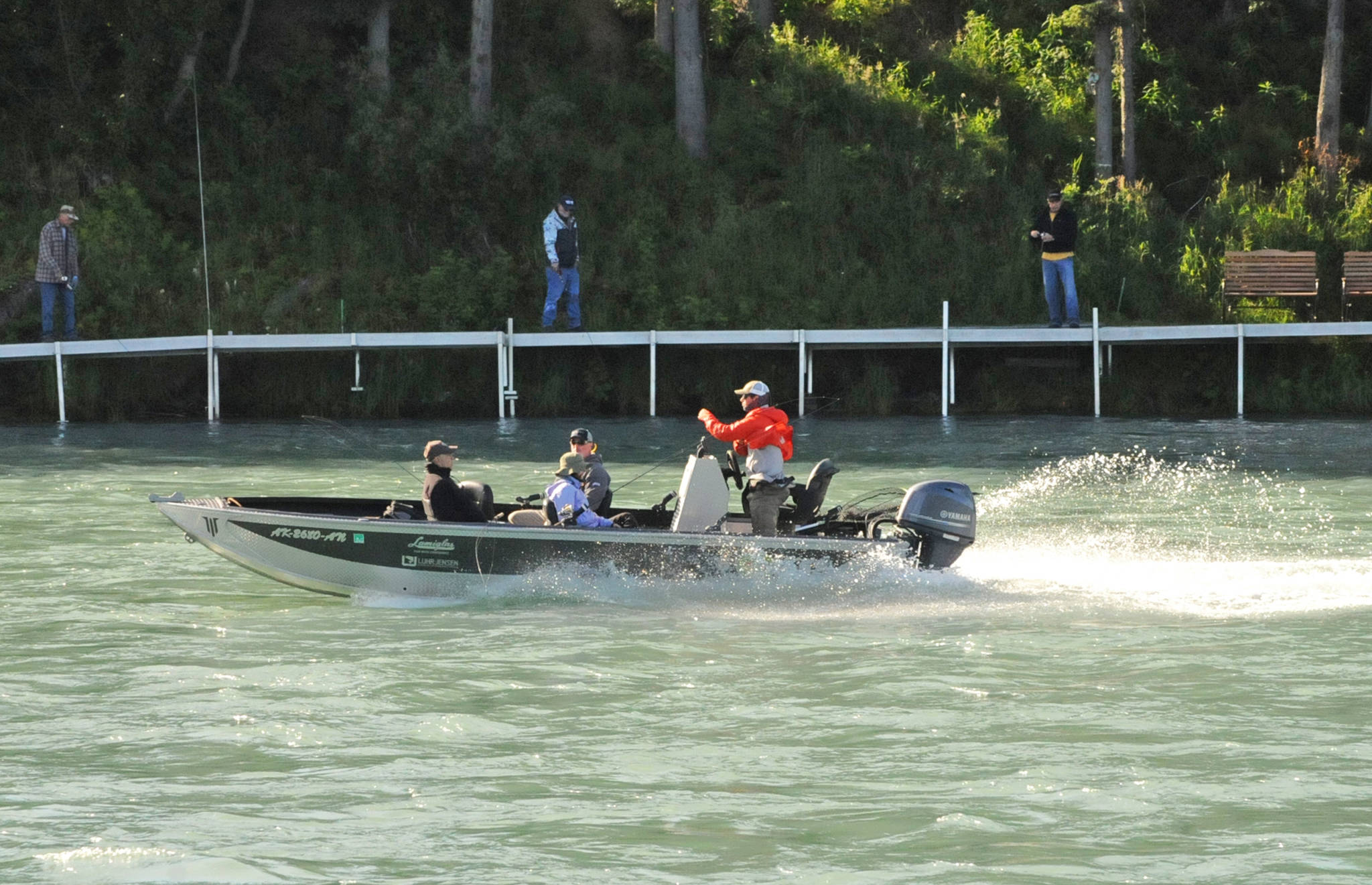 Anglers powerboat up the Kenai River near Soldotna Creek Park on Wednesday, July 18, 2018 in Soldotna, Alaska. The water in the Kenai River is a little higher than usual — about 9.71 feet, according to U.S. Geological Survey’s gauge at Soldotna — but has fallen since last week and is significantly below the flood stage of 12 feet. Anglers were hitting the banks on Wednesday morning for sockeye salmon, which normally peak in returning numbers to the Kenai River in mid-July. (Photo by Elizabeth Earl/Peninsula Clarion)