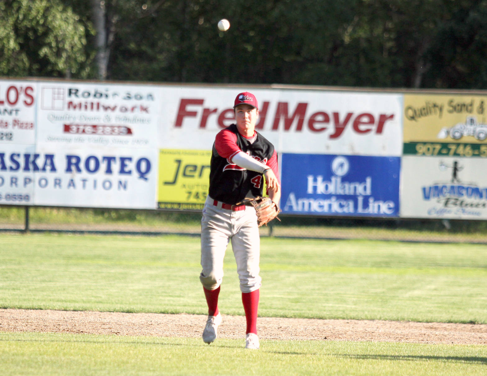 Peninsula Oilers shortstop Bryce Begell makes the throw to first during a 7-5 loss to Mat-Su Friday night in Palmer. (Photo by Jeremiah Bartz/Frontiersman)