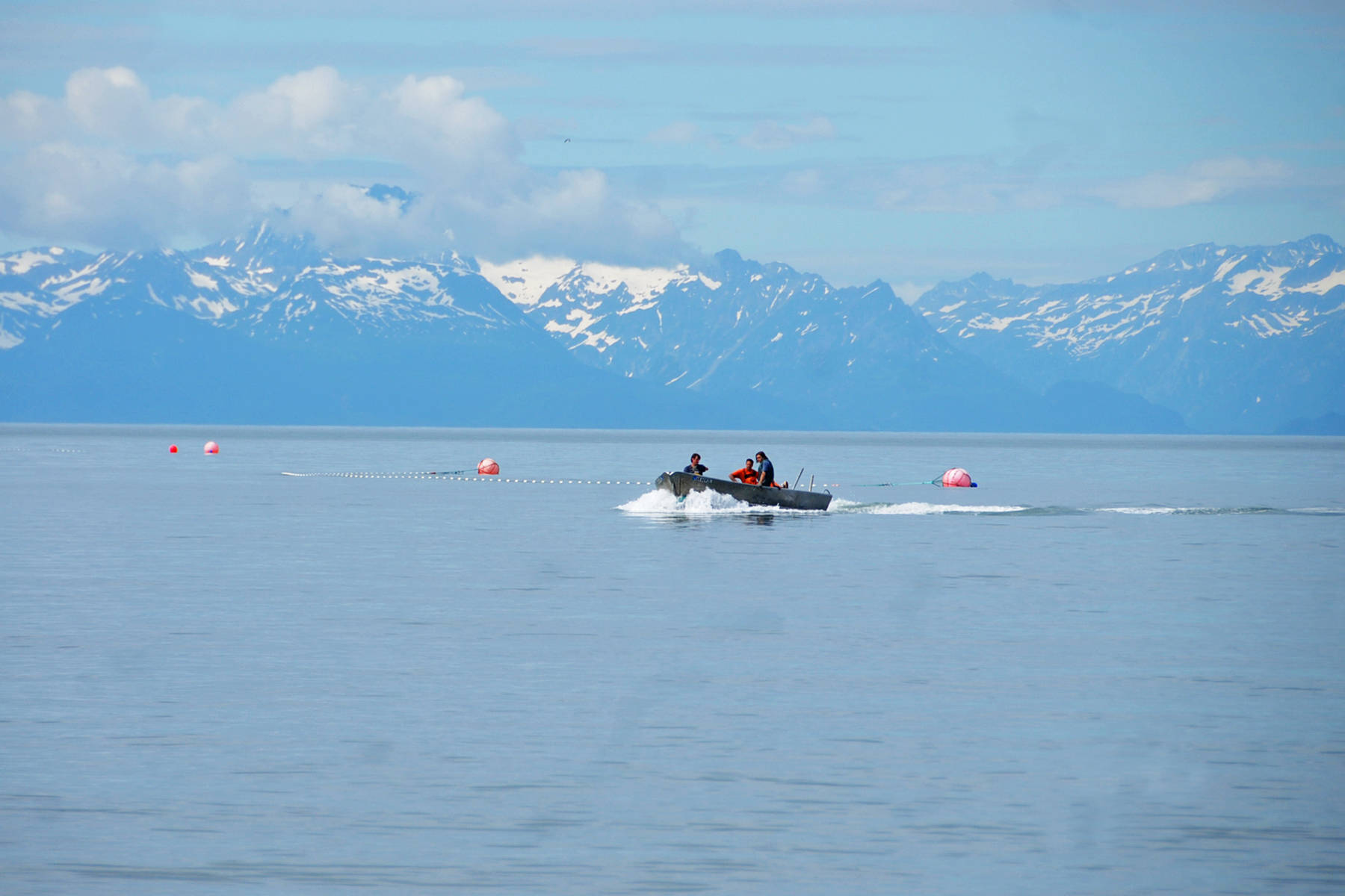 Setnetters make their way back to the beach near a site on July 11, 2016 near Kenai, Alaska. (Photo by Elizabeth Earl/Peninsula Clarion, file)