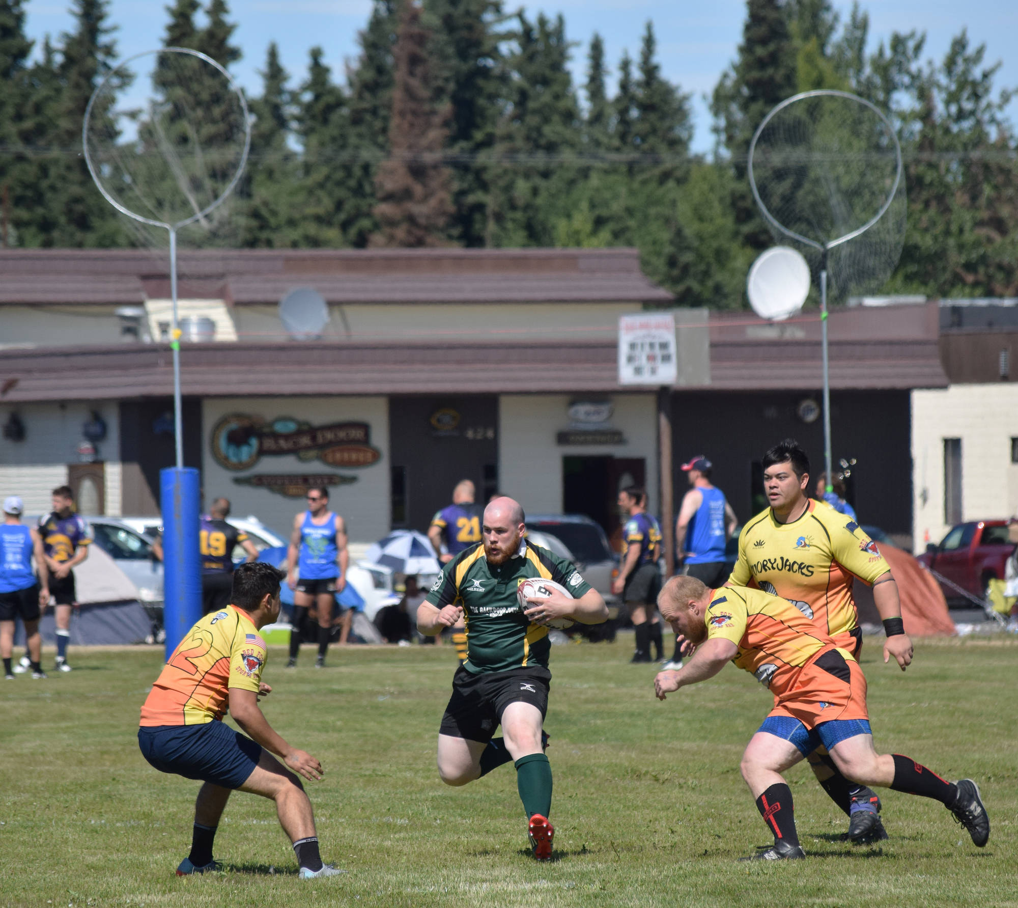 Kenai Wolfpack and Fairbanks SunDawgs players compete in a loser-out semifinal Saturday at the Between the Tides Dipfest Rugby 10’s tournament at Spur View field in Kenai. (Photo by Joey Klecka/Peninsula Clarion)