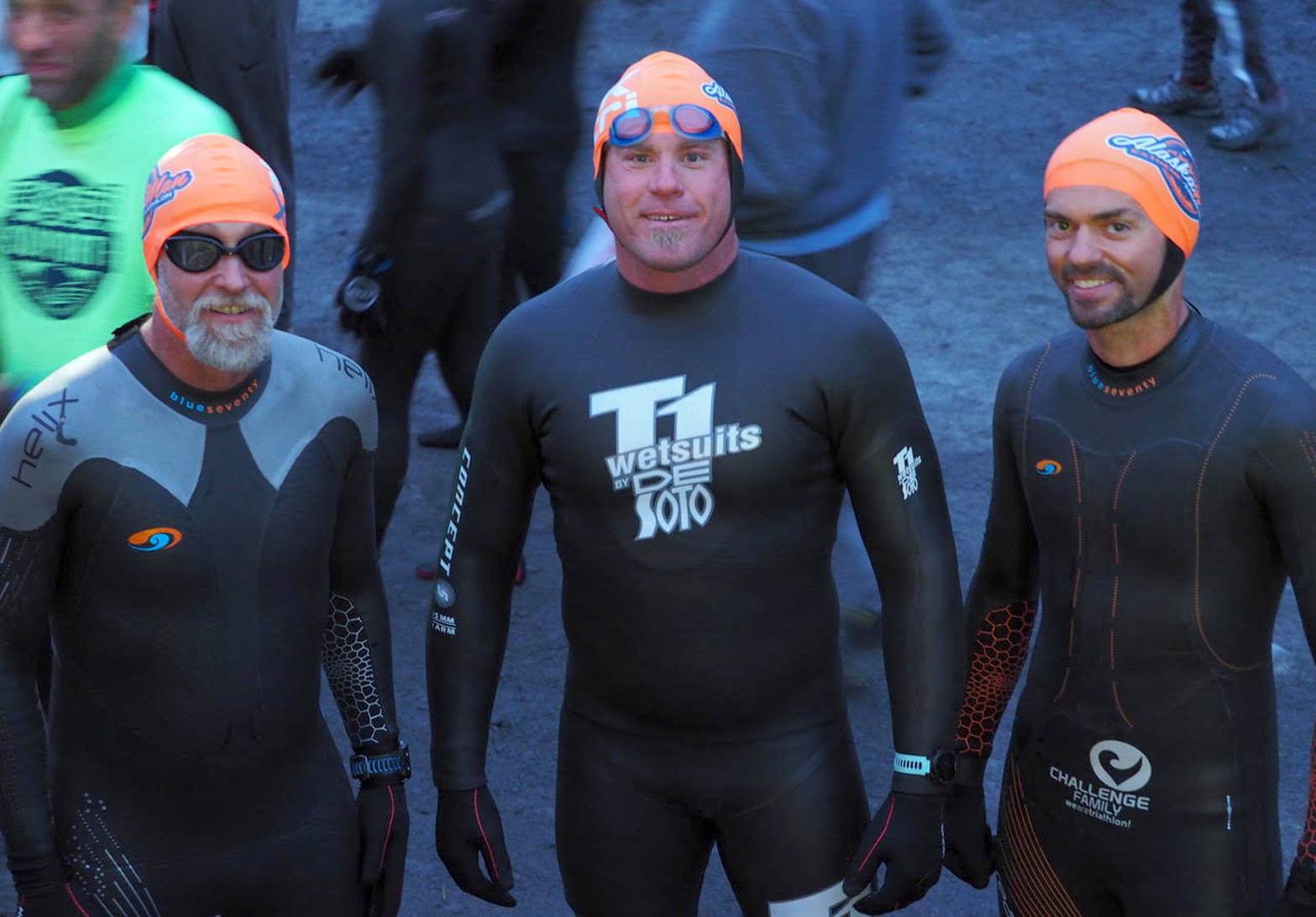 Kenai’s Jeff McDonald, Kenai’s Eric Thomason and Anchorage’s Jason Moore get ready to jump in the water for the swim leg of the Alaskaman Extreme Triathlon on Saturday, July 21, 2018, in Seward. (Photo provided by Dana McDonald)