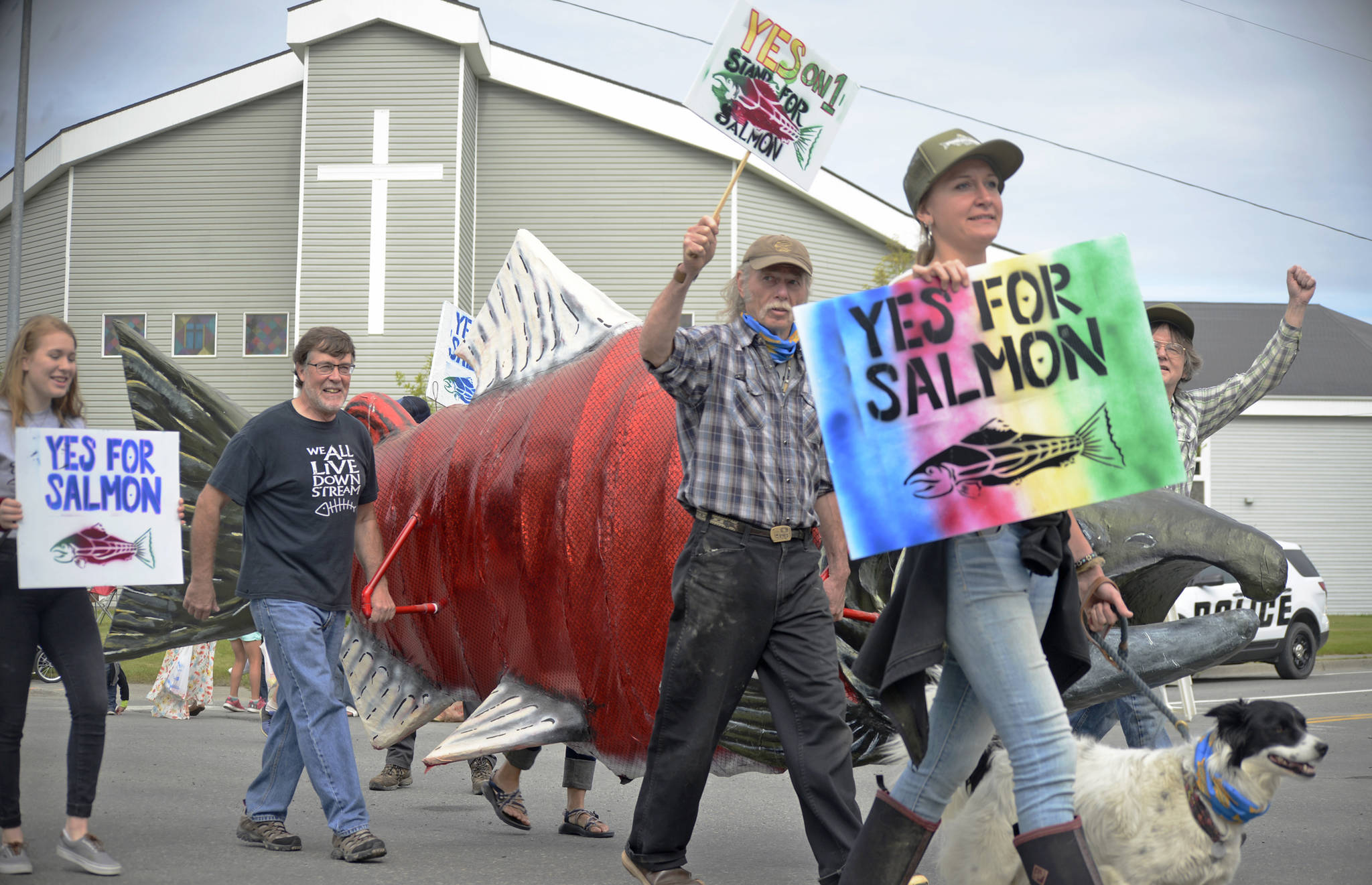Volunteers in Stand for Salmon’s float in the Progress Days parade carry a large replica of a sockeye salmon down Marydale Avenue on Saturday, July 28, 2018 in Soldotna, Alaska. The parade kicks off the weekend-long event celebrating Soldotna’s history, with a market on Saturday and Sunday in Soldotna Creek Park and a concert Saturday night followed by a free community barbecue Sunday. (Photo by Elizabeth Earl/Peninsula Clarion)
