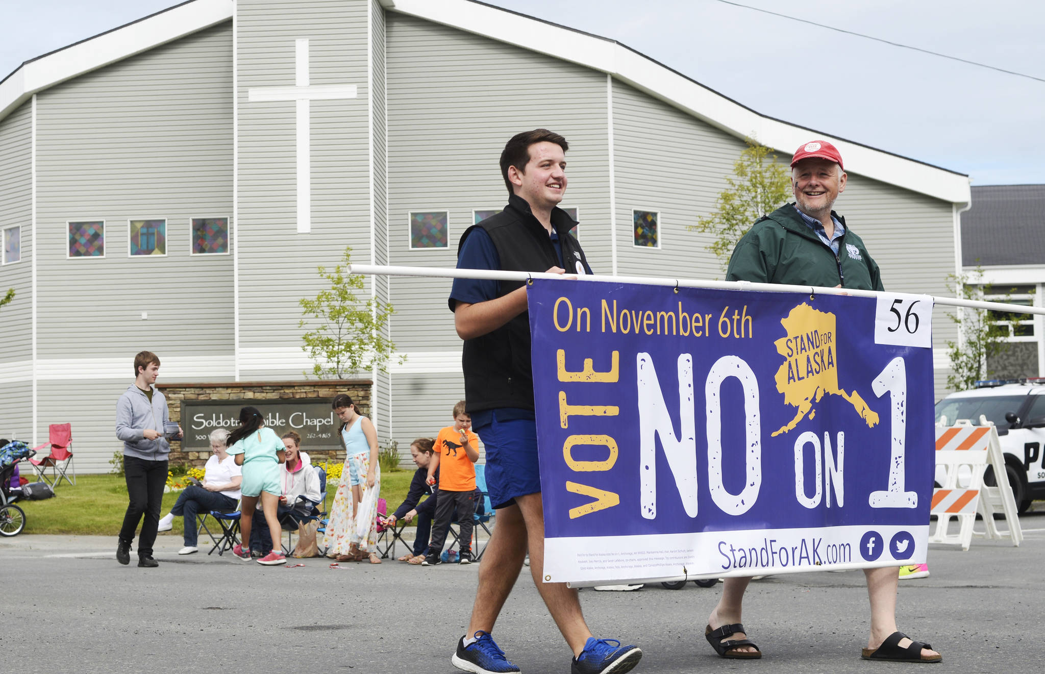 Participants in Stand for Alaska’s float in the Progress Days parade make their way down Marydale Avenue on Saturday, July 28, 2018 in Soldotna, Alaska. The parade kicks off the weekend-long event celebrating Soldotna’s history, with a market on Saturday and Sunday in Soldotna Creek Park and a concert Saturday night followed by a free community barbecue Sunday. (Photo by Elizabeth Earl/Peninsula Clarion)