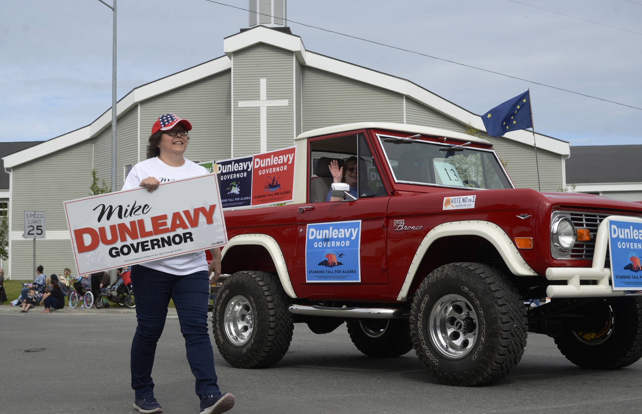 Volunteers for gubernatorial candidate Mike Dunleavy’s float in the Progress Days parade make their way down Marydale Avenue on Saturday, July 28, 2018 in Soldotna, Alaska. The parade kicks off the weekend-long event celebrating Soldotna’s history, with a market on Saturday and Sunday in Soldotna Creek Park and a concert Saturday night followed by a free community barbecue Sunday. (Photo by Elizabeth Earl/Peninsula Clarion)
