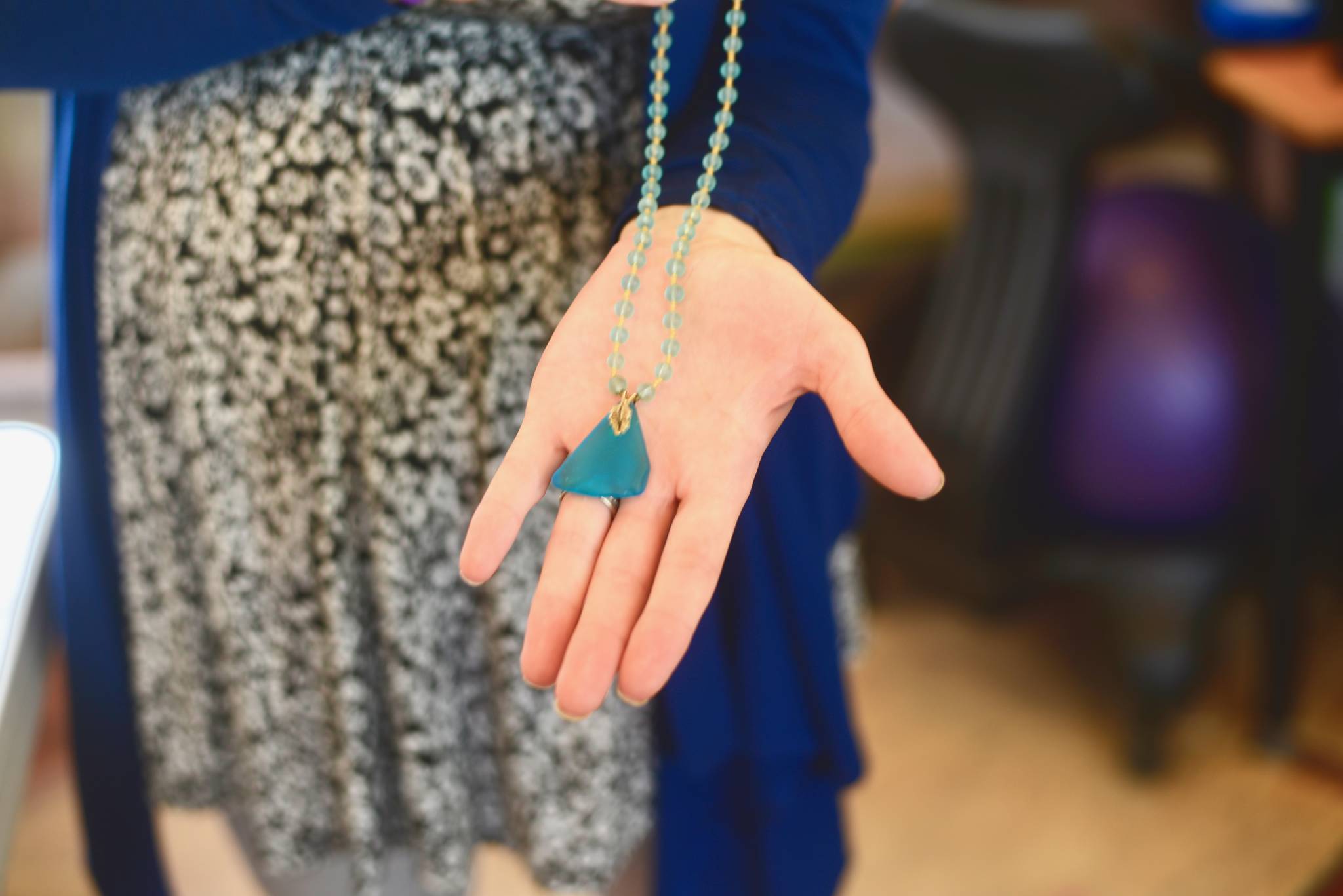 Jenna Bedford presents her first Alaska Sea Glass creation, which she wore as part of her Caring for the Kenai project in 2012, on Friday, July 27, 2018, in Nikiski, Alaska. (Photo by Victoria Petersen/Peninsula Clarion)