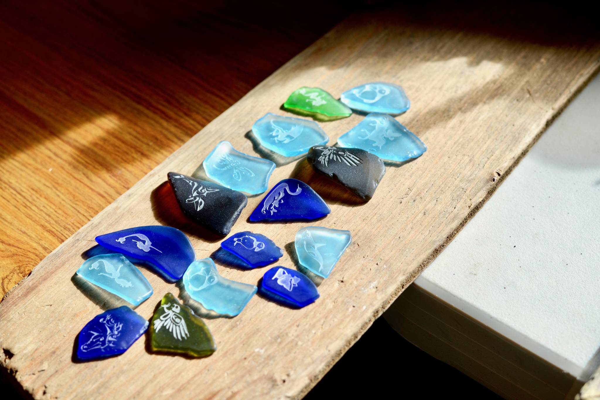 Alaska Sea Glass now offers etching services on their glass pendants on Friday, July 27, 2018, in Nikiski, Alaska. (Photo by Victoria Petersen/Peninsula Clarion)