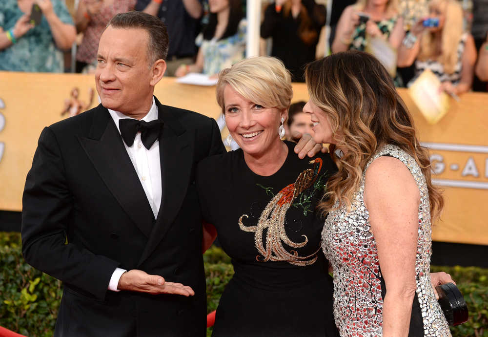 From left, Tom Hanks, Emma Thompson, and Rita Wilson arrive at the 20th annual Screen Actors Guild Awards at the Shrine Auditorium on Saturday, Jan. 18, 2014, in Los Angeles. (Photo by Jordan Strauss/Invision/AP)