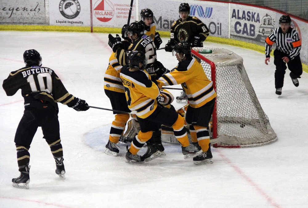 Photo by Dan Balmer Peninsula Clarion Kenai River forward Nathan Colwell (center) reacts after chipping in the game-winning goal with less than two minutes remaining Thursday night at the Soldotna Regional Sports Complex. The Brown Bears went on to win 4-3 over the Austin Bruins, despite giving up two third period goals. Brown Bears forwards Albin Karlsson (top) and Alec Butcher (left) assisted on the play.