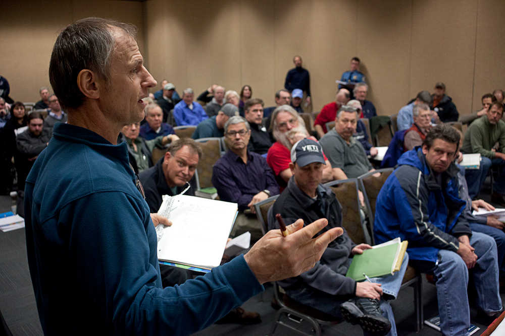 Photo by Rashah McChesney/Peninsula Clarion  Brent Johnson, a commercial setnetter from Clam Gulch, talks about his proposal to allow setnetters to fish an experimental type of setnet he calls special harvest modules, Thursday Feb. 8, 2014 during the triennial Board of Fisheries meeting on the Upper Cook Inlet.