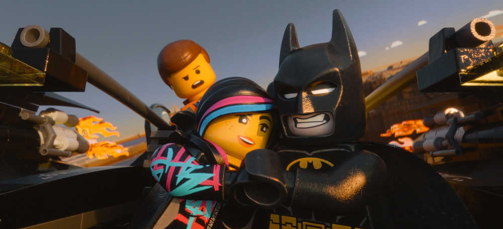 This image released by Warner Bros. Pictures shows characters, from left, Emmet, voiced by Chris Pratt, Wyldstyle, voiced by Elizabeth Banks and Batman, voiced by Will Arnett, in a scene from "The Lego Movie." (AP Photo/Warner Bros. Pictures)