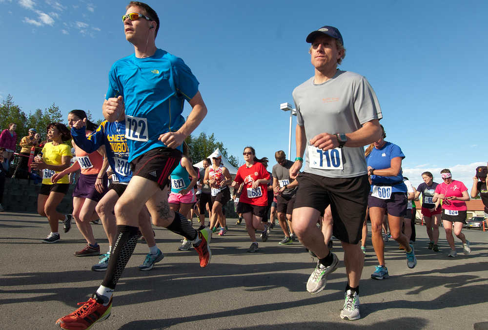 Photo by Rashah McChesney/Peninsula Clarion  Runners take off June 9, 2013 during the annual Run for the River sponsored by the Kenai Watershed Forum as part of the Kenai River Festival in Soldotna, Alaska. Part of the city's plan to support local business is to help publicize the area's many events.