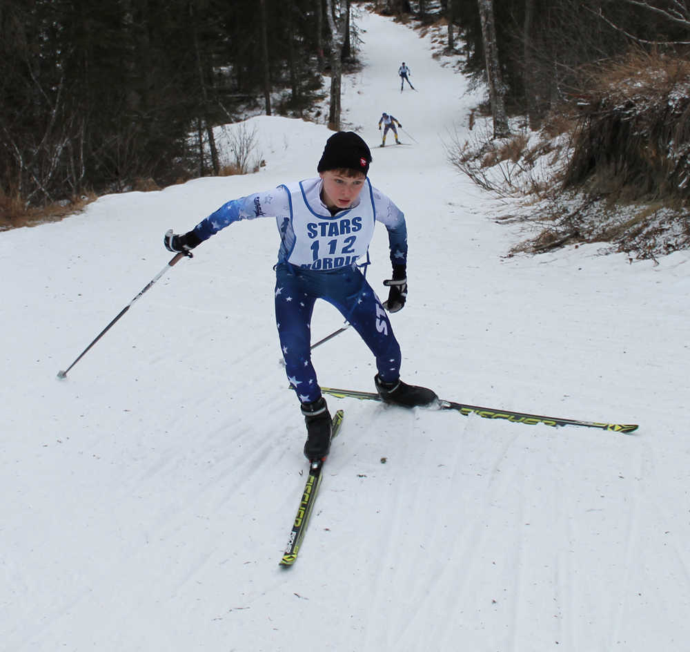 Photo by Jeff Helminak Soldotna High School's Addison Downing climbs a big hill near the start of Friday's boys five-kilometer freestyle at the Region III Nordic Ski Championships at Tsalteshi Trails.
