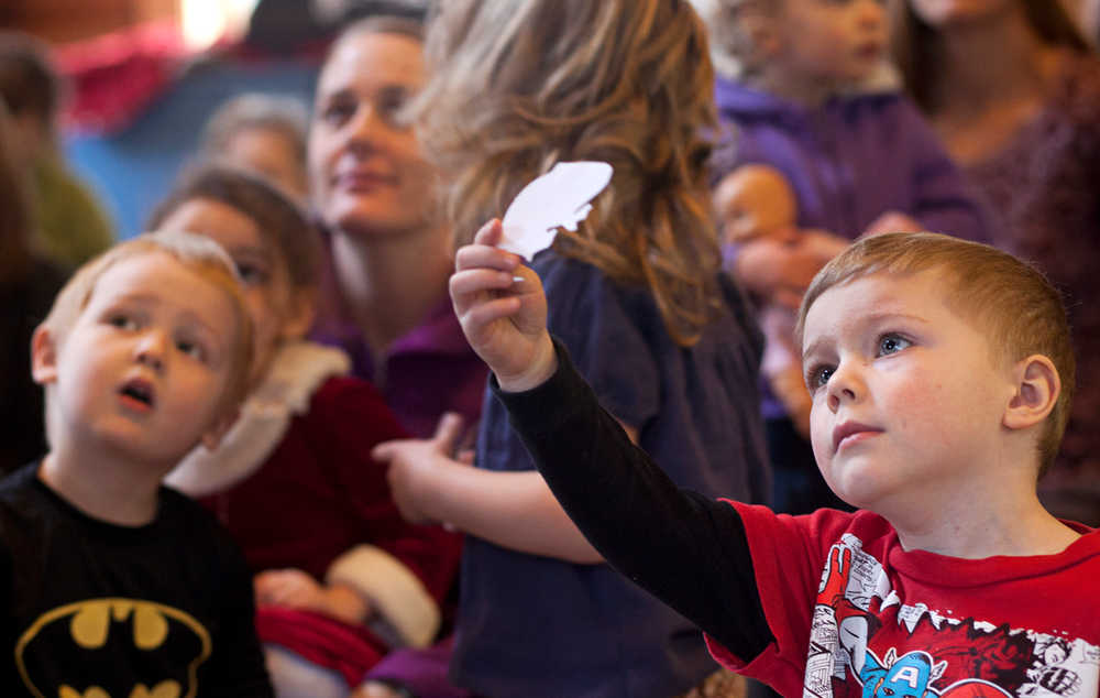 Photo by Rashah McChesney/Peninsula Clarion  Drake Anthony, 4, looks at a cutout of a rodent that he found during a class at the Kenai National Wildlife Refuge Thursday Feb. 20, 2014 in Soldotna, Alaska.