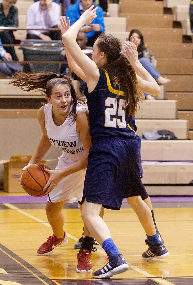Photo by Rashah McChesney/Peninsula Clarion Skyview's Meghan Powers looks for an opening to pass during their game against Homer Friday Feb. 28, 2014 in Soldotna, Alaska.