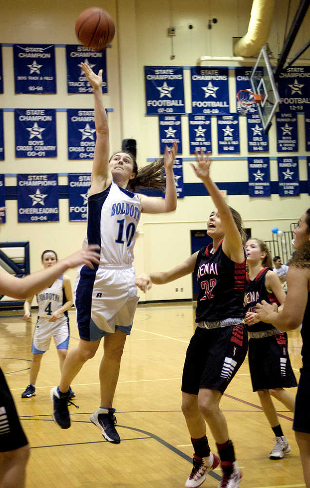 Photo by Rashah McChesney/Peninsula Clarion  Soldotna's Julie Litchfield shoots during their game against Kenai Saturday March 1, 2014 in Soldotna, Alaska.