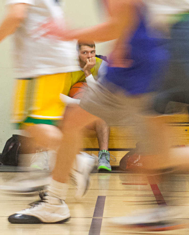 Photo by Rashah McChesney/Peninsula Clarion  Jason Daniels takes a shot during a city league seven team single elimination tournament Tuesday March 3, 2014 at the Kenai Recreation Center in Kenai, Alaska.