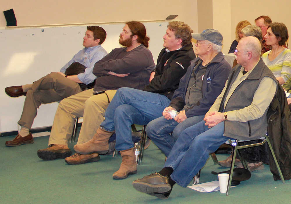 Photo by Dan Balmer/Peninsula Clarion Members of the public listen to Kenai City Manager Rick Koch give his recommendations to the city council at a dipnet work session Tuesday evening at Kenai City Hall.
