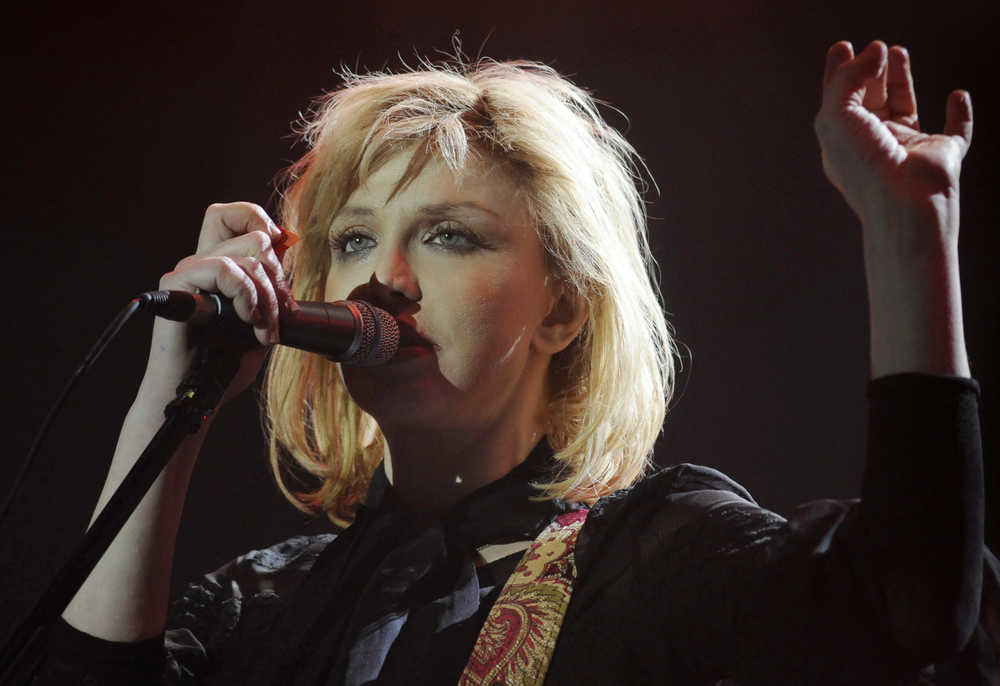 FILE - In this Aug. 28, 2010 file photo, Courtney Love of the U.S. band Hole performs at the Sluzewiec Racing Track in Warsaw, Poland. Love hadn't been born and tweeting was reserved for birds when The New York Times won a landmark libel case at the Supreme Court in 1964. But when a California jury decided recently that Love shouldn't have to pay $8 million for a troublesome tweet about her former lawyer, she became just the latest person to lean on New York Times v. Sullivan, a case decided 50 years ago Sunday, and the cases that followed and expanded it. (AP Photo/Alik Keplicz, File)