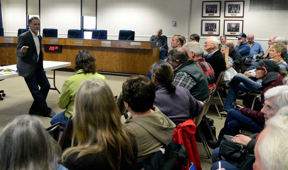 Photo by Dan Balmer/Peninsula Clarion Senator Peter Micciche R-Soldotna answers questions from a capacity crowd Saturday at the Kenai Peninsula Borough Assembly Chambers in Soldotna. This past weekend, the former Soldotna mayor returned from Juneau to give an overview of his work at the mid-point in the legislative session.