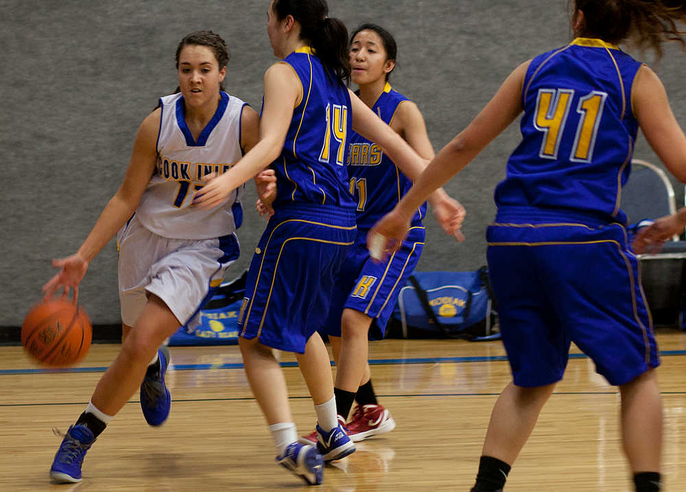 Photo by Rashah McChesney/Peninsula Clarion  Cook Inlet Academy's Kendall Toplin drives the ball down the court during a Jan. 24, 2014 game in Soldotna, Alaska.