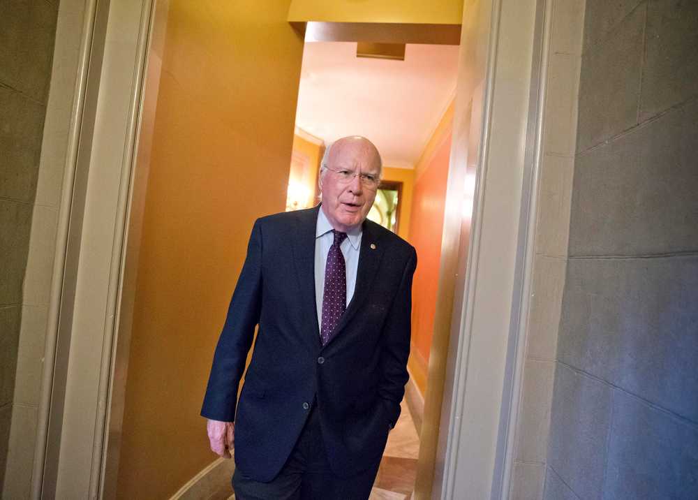 FILE - This Oct. 14, 2013 file photo shows Senate Judiciary Committee Chairman Patrick Leahy, D-Vt., walking through a corridor at the Capitol in Washington. Leahy said he's "concerned the growing trend toward relying upon FOIA exemptions to withhold large swaths of government information is hindering the public's right to know." (AP Photo/J. Scott Applewhite)