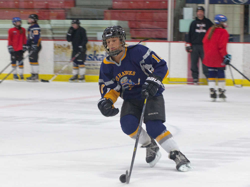 Photo by Rashah McChesney/Peninsula Clarion  Kylie Morse works on a drill during practice with her U16 girl's hockey team Friday March 14, 2014 at the Soldotna Sports Complex in Soldotna, Alaska.