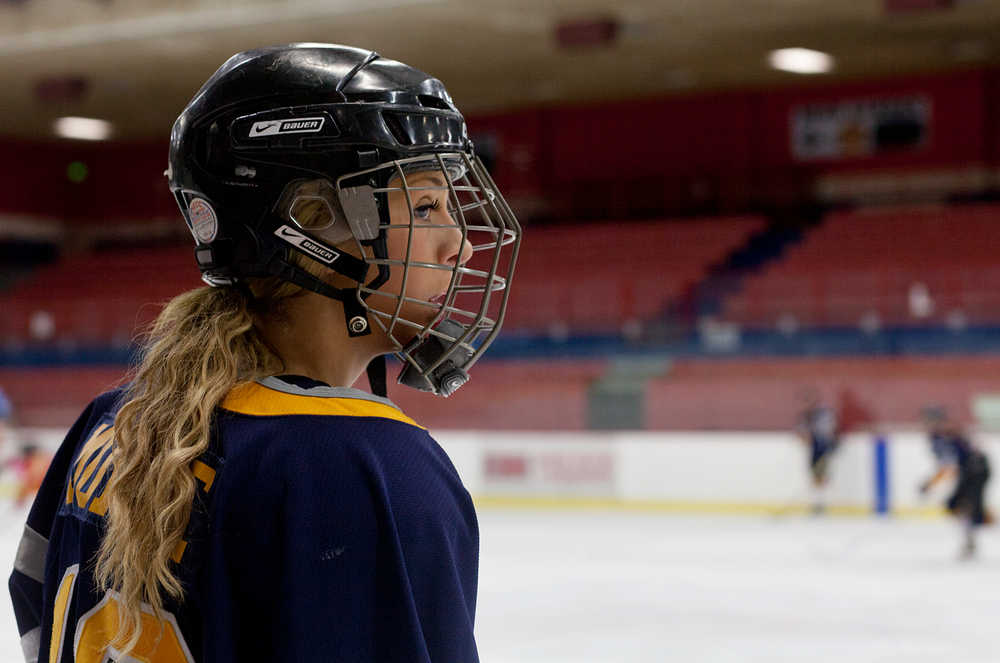Photo by Rashah McChesney/Peninsula Clarion  Kylie Morse watches her U16 girls hockey team practice Friday March 14, 2014 at the Soldotna Sports Center in Soldotna, Alaska. The team has made it to nationals and will be travelling to New York to play.