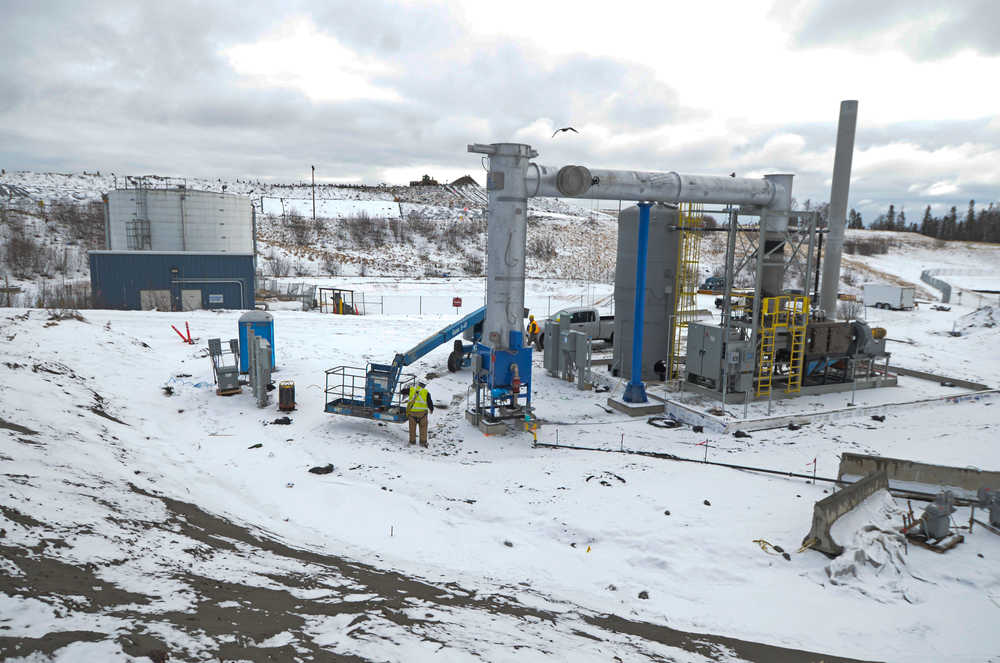 Photo by Rashah McChesney/Peninsula Clarion   Les Brady, operations manager for Heartland Technology Partners, works to bring a leachate thermal evacuation unit online Monday March 17, 2014 at the Central Peninsula Landfill in Soldotna, Alaska.