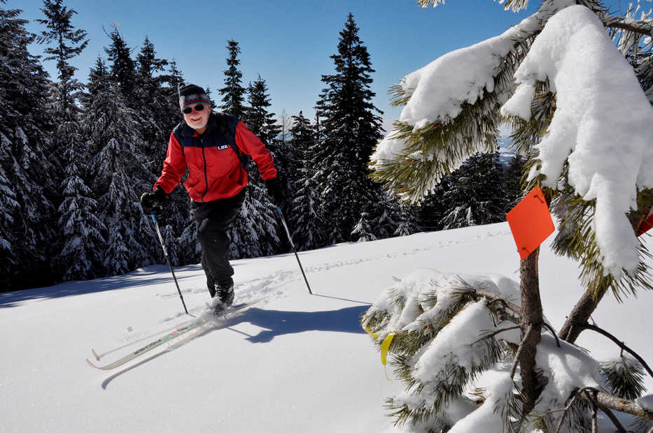 Art Bookstrom, 75, breaks trail on a cross-country skiing route he marked with orange triangles for the enjoyment of skiers who want an old-fashioned nordic skiing experience off the wide, groomed trails at Mount Spokane State Park. (AP Photo/The Spokesman-Review, Rich Landers)