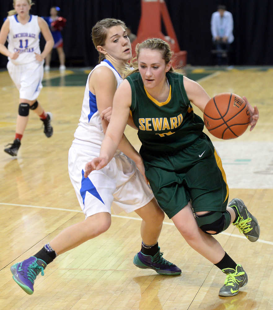 Seward's Ashley VonBorstel drives against Anchorage Christian's Hollie Duncan during their 3A girls state basketball game at Anchorage's Sullivan Arena on Thursday.