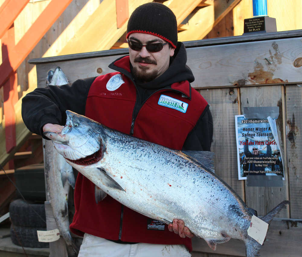With a king salmon weighing 30.60 pounds, Raymond B. Tepp of Kenai takes first place in the Homer Winter King Salmon Tournament. Fishing aboard the Inlet Plunder, Tepp's first-place cash prize was $19,026.
