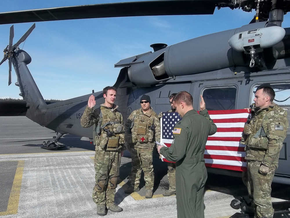 Courtesy photo Debbie Harris  Duncan Harris, of Kenai, gets sworn in as he reenlists in the Alaska Air National Guard as a search and rescue airman with the 176th rescue wing Wednesday March 26, 2014 in Kenai, Alaska.