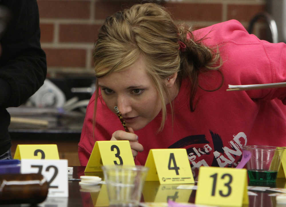 In this photo taken on Wednesday, March 19, 2014, Ali Stark catalogs evidence at the mock crime scene during her Forensic Science class at Adams Central High School in Hasting, Neb. (AP Photo/The Hastings Tribune, Amy Roh)