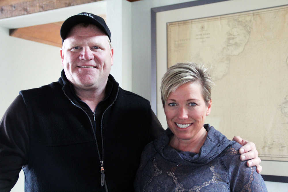 Photo by Kaylee Osowski/Peninsula Clarion Ron Hyde, CEO of PRL Logistics, Inc. stands with wife Suzy Hyde in front of a map that was found during the company's renovation of a Kenai Landing cannery. Hyde expects to begin operating out of the new Kenai branch in about a month.