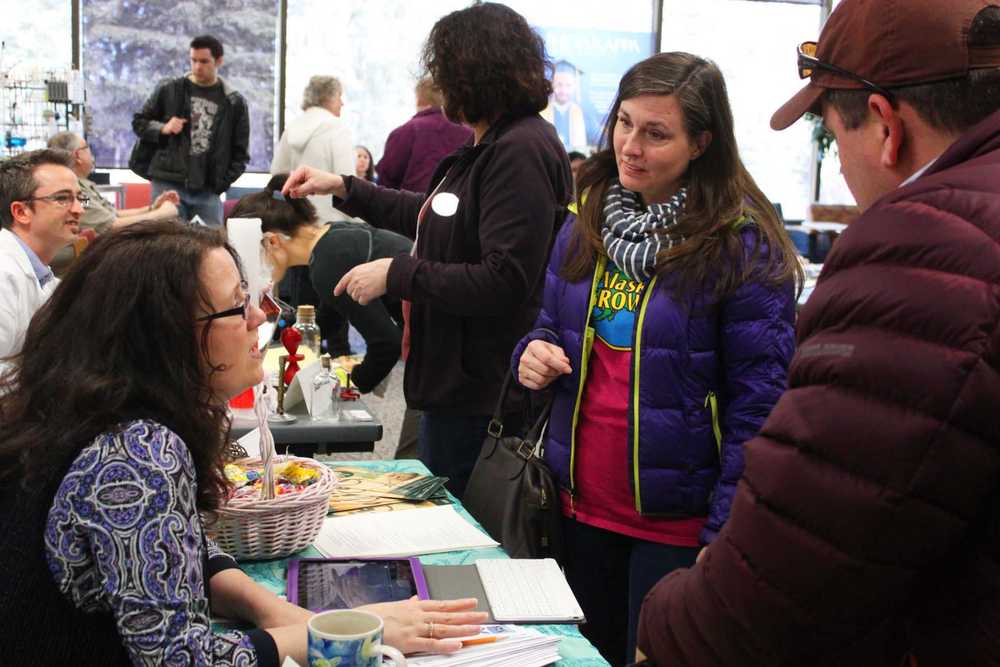 Photo by Kelly Sullivan/ Peninsula Clarion Petie, Tatianna and Doug Clary talk to Bettina Kipp Lavea during the Advice and a Slice event, Friday, April 11, at KPC.